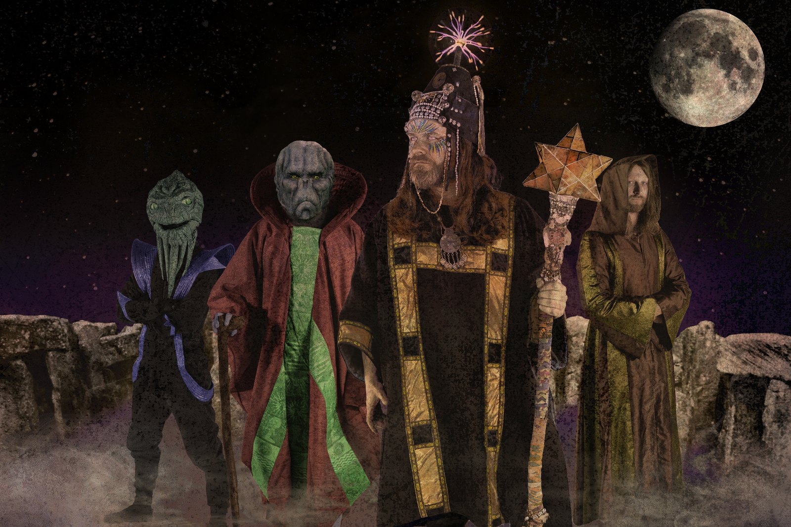 HENGE in full costume at a stone circle under a full moon