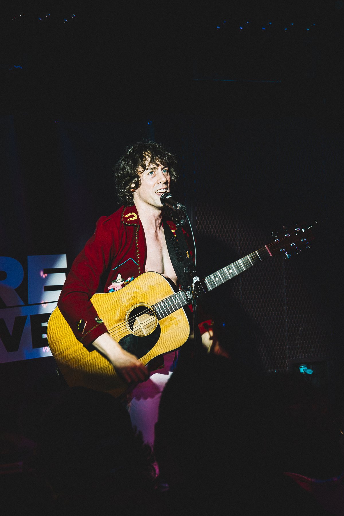 Johnny Borrell of Razorlight playing acoustic guitar at the Barfly in Camden